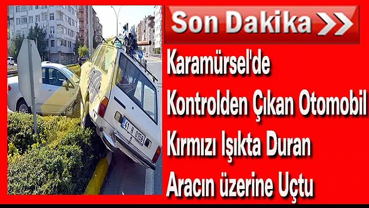 Karamürsel'de kontrolden çıkan otomobil kırmızı ışıkta duran aracın üzerine uçtu